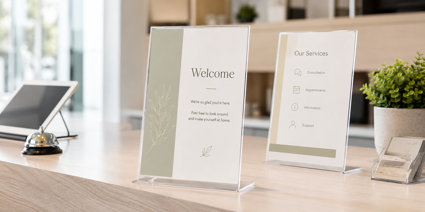 A4 sign holders displayed on a modern reception counter for notices, service information and visitor messages.