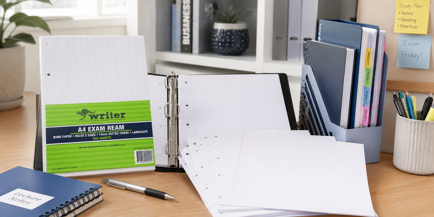 Loose leaf refill paper organised on a study desk with a binder, notebooks and stationery for school, university and office note taking.