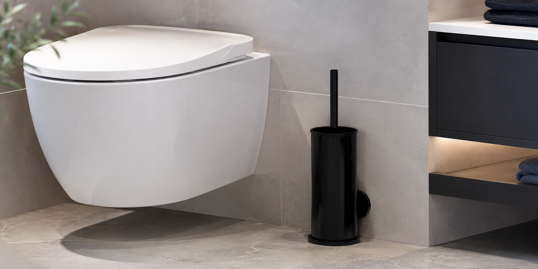 Black toilet brush and holder beside a modern toilet in a clean corporate bathroom or commercial washroom