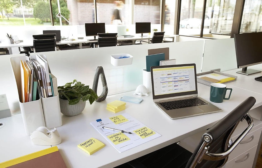 Yellow sticky notes on a study desk with notebook and pen for classic reminders, assignments and quick messages.