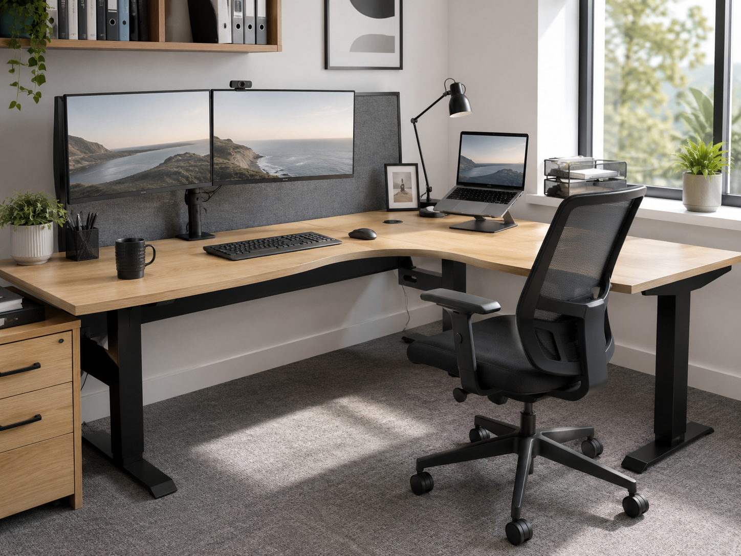 Office corner workstation with dual monitors, laptop and desk accessories in a bright modern home office.