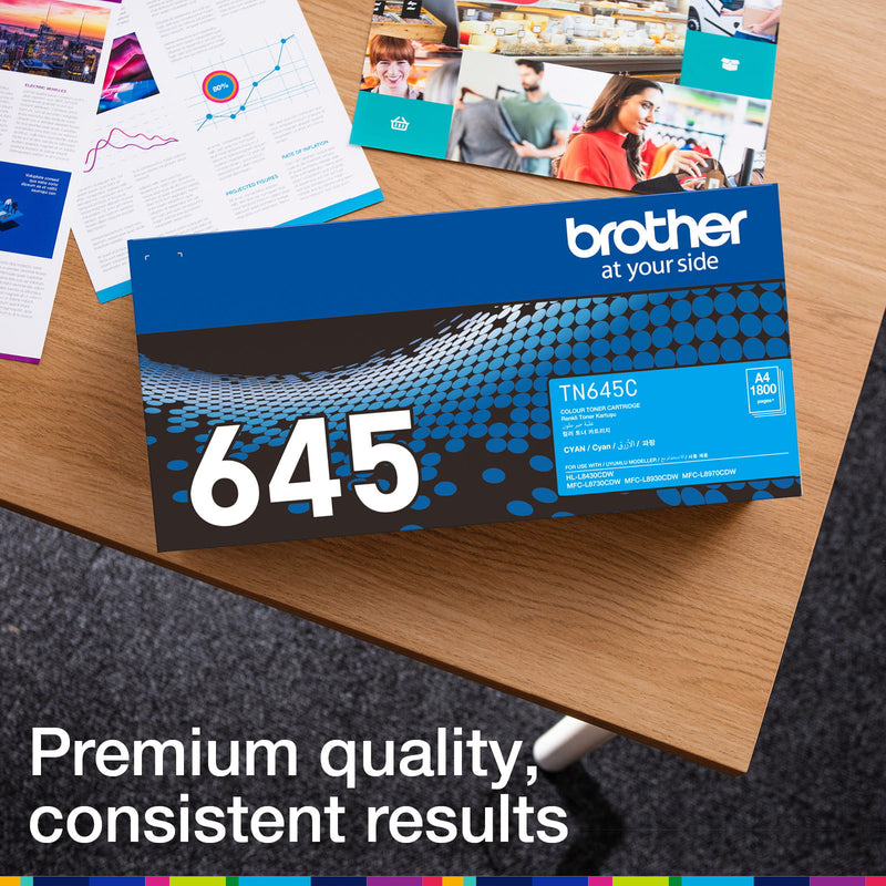 Brother TN-645C retail carton photographed beside printed colour documents