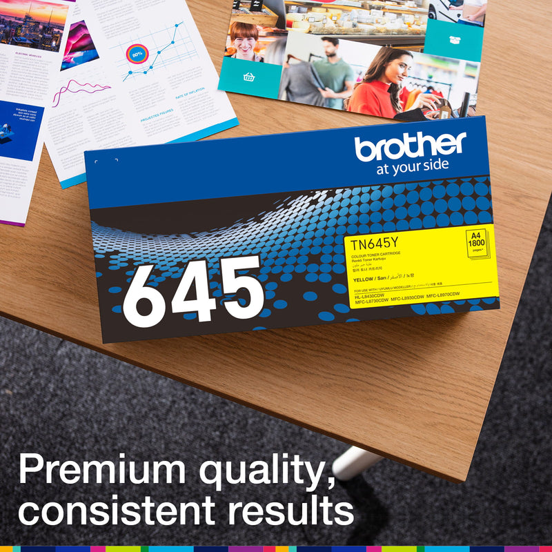 Brother TN-645Y retail carton photographed beside printed colour documents