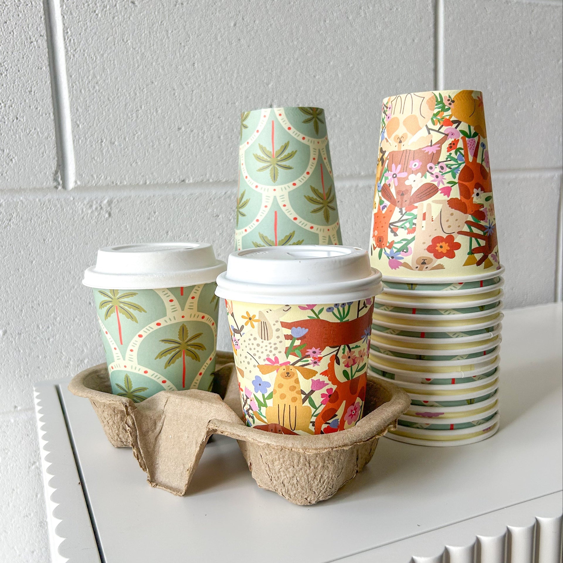 Creative Cafe Co 12oz Dogs & Palms coffee cup with cup tray