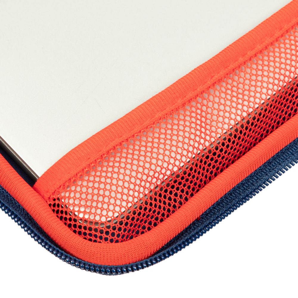 Close-up of a red mesh pouch with a blue zipper on a white background
