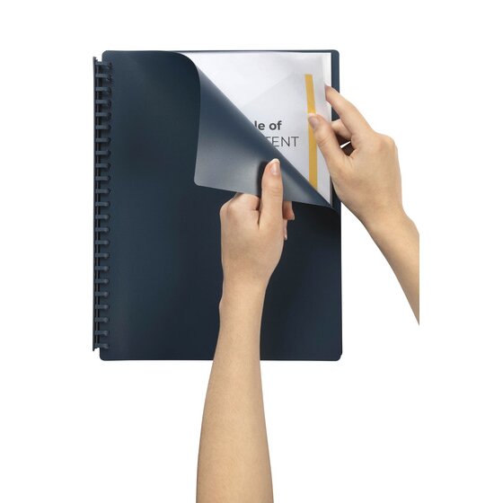 A dark blue Marbig A4 refillable display book held open while a printed page is fed into the first clear pocket behind the deep blue front cover.