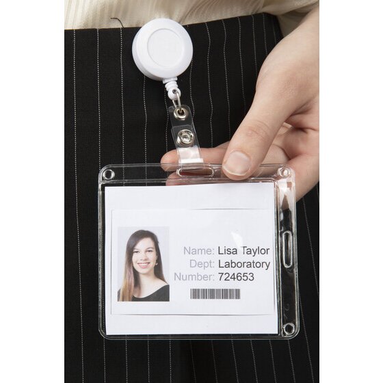 Clear Rexel card pouch hung landscape from a white badge reel at the waist, holding a sample staff card, with the side slot visible on the right