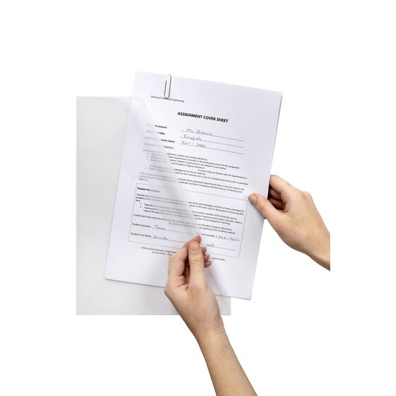 Two hands sliding a printed assignment cover sheet into a clear Marbig Ultra A4 letter file, showing the open top and side edges