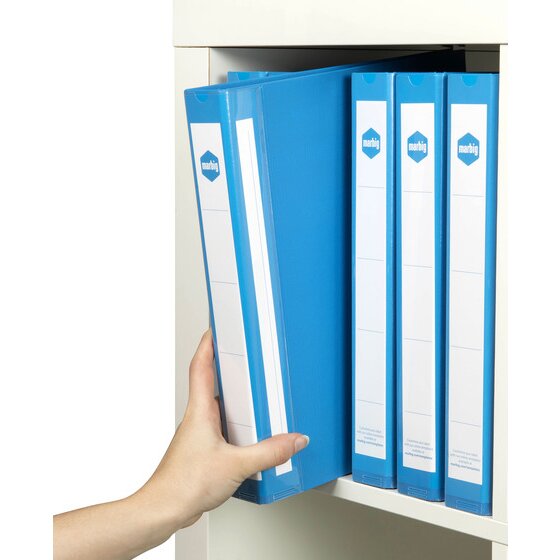 A hand lifting a blue Marbig 5004001 A4 ring binder out of a white cabinet with three more blue binders standing beside it, marbig spine labels facing out.