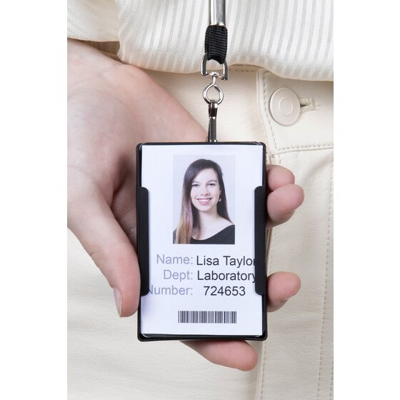 Black Rexel multi card holder hung portrait from a lanyard clip and held in a hand, showing an upright sample staff card with photo