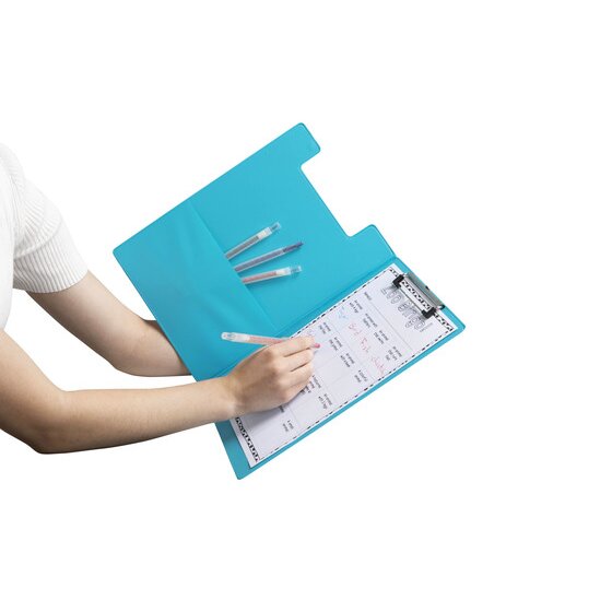 Hand writing on a sheet held in an open blue Marbig Summer Colours clipfolder, pens tucked into the pocket inside the cover