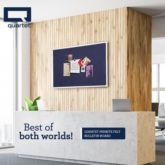 Quartet reception scene with a dark blue Penrite felt pinboard on a timber slat wall holding cards and notes, above a concrete look front desk carrying Quartet Penrite felt lettering