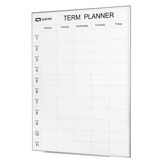Quartet Term Planner QTTERM1209A, angled view showing the silver frame edge, the TERM PLANNER heading, Monday to Friday columns and week rows 1 to 11, with a tray along the lower edge