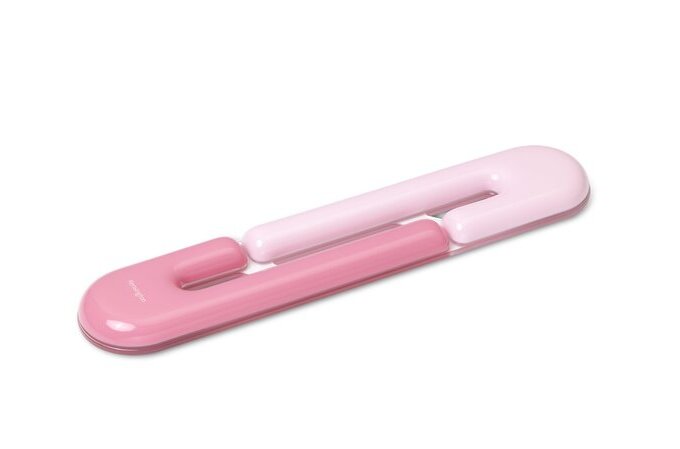 Pink and white plastic tool on a white background