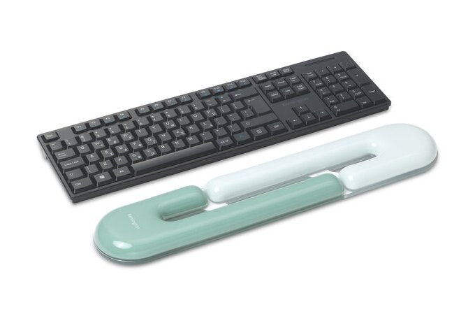 Black keyboard with a green wrist rest on a white background