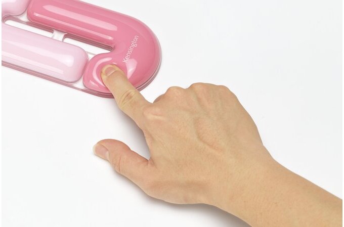 Pink inflatable tube with a hand pressing on it against a white background