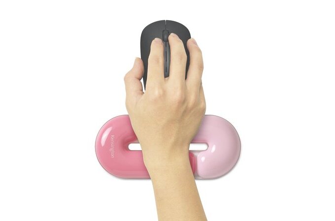 Hand using a computer mouse on a pink wrist rest against a white background