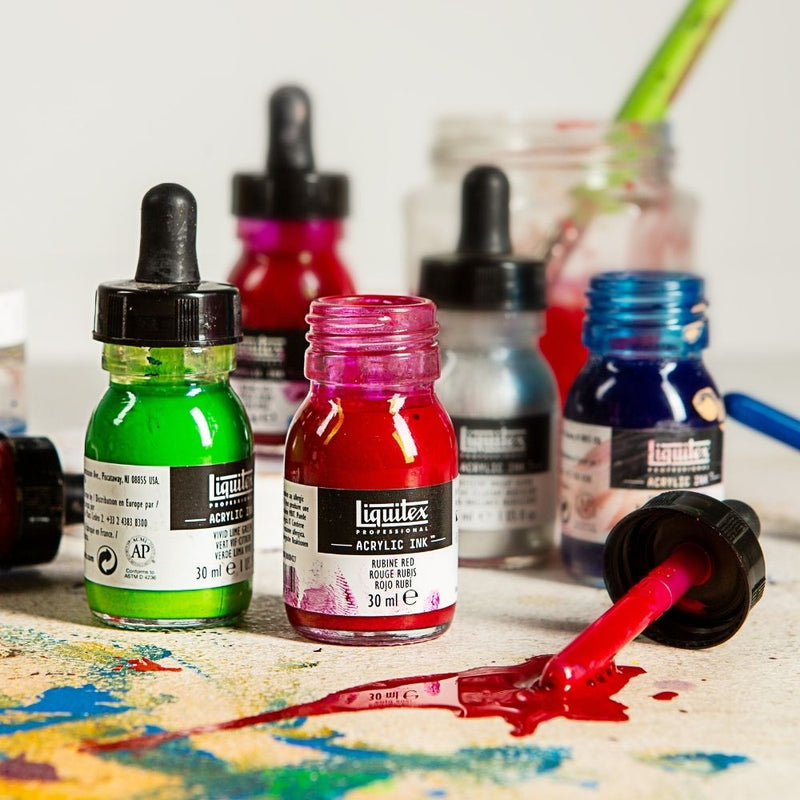 Liquitex Professional Acrylic Ink range photo from Liquitex: Vivid Lime Green and Rubine Red 30 ml bottles with an open red dropper and spilled ink. Other range colours shown for context, not the Cadmium Yellow Light Hue 159 bottle