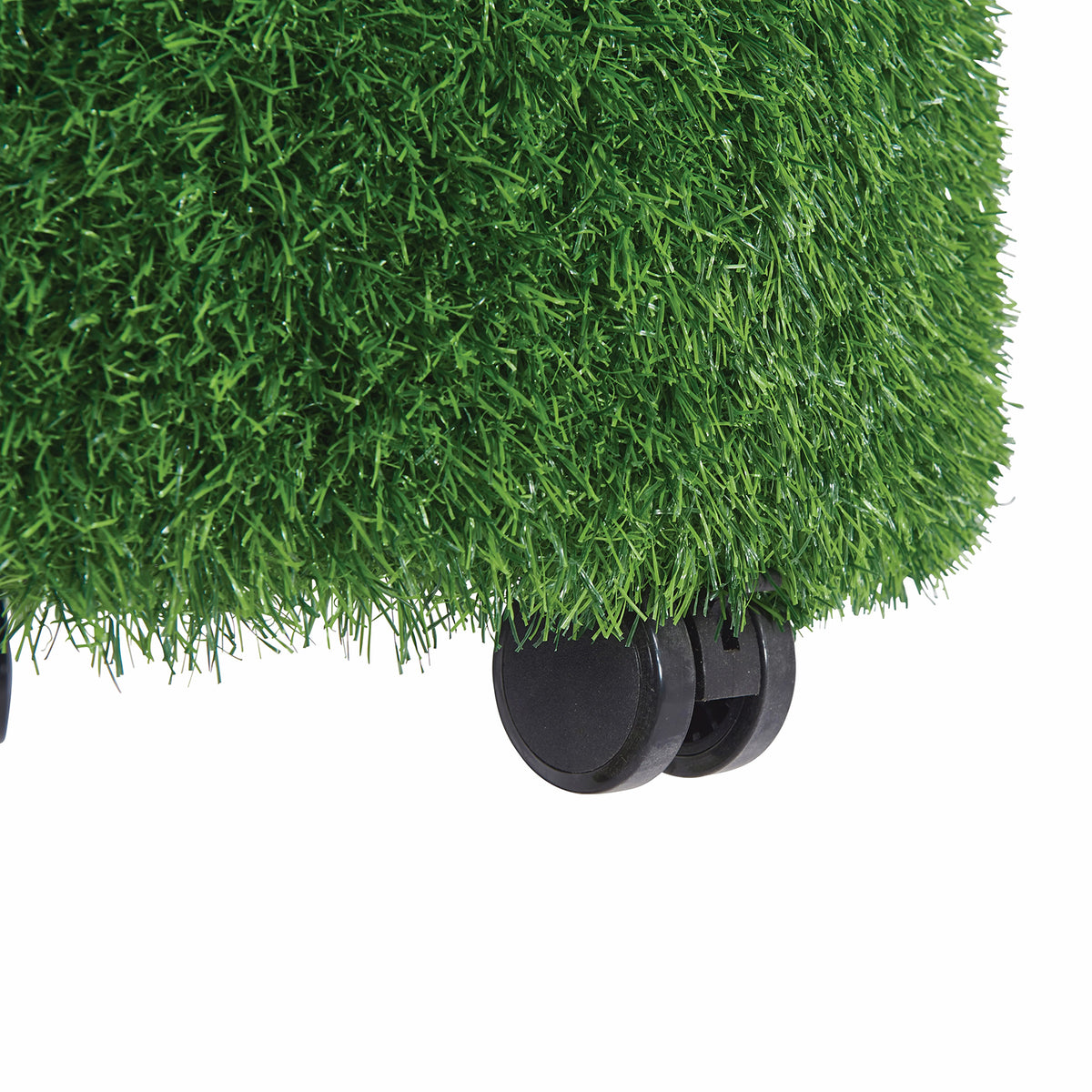 Detailed product close up of the MTA Essentials Aalto Grass Ottoman showing its thick green artificial grass textured covering and black castor assembly against a clean white background. The image highlights the tactile upholstery and mobile base construction designed to support flexible positioning within indoor educational and sensory environments.