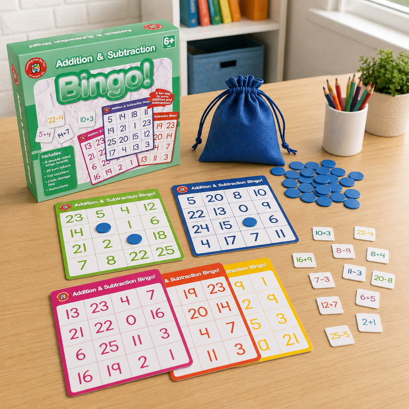 Complete Addition and Subtraction Bingo educational set displayed with retail packaging, colourful double sided bingo boards, sum tokens, counters and storage bag. The image highlights all included components designed to support engaging maths learning activities.