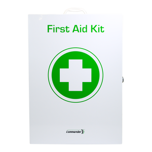 White metal wall cabinet with a large green cross roundel, printed First Aid Kit and carrying the Commander mark at the foot of the door