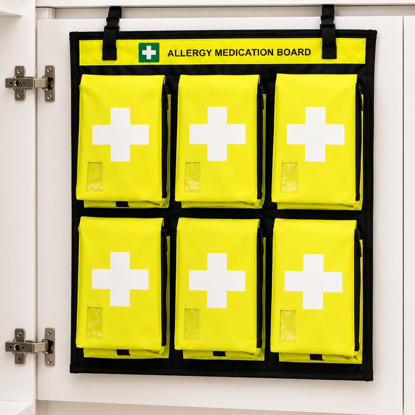 AeroKit Allergy Medication Board mounted inside a first aid cabinet, showing six high visibility individual storage pouches arranged in two rows beneath the clearly marked allergy medication heading.