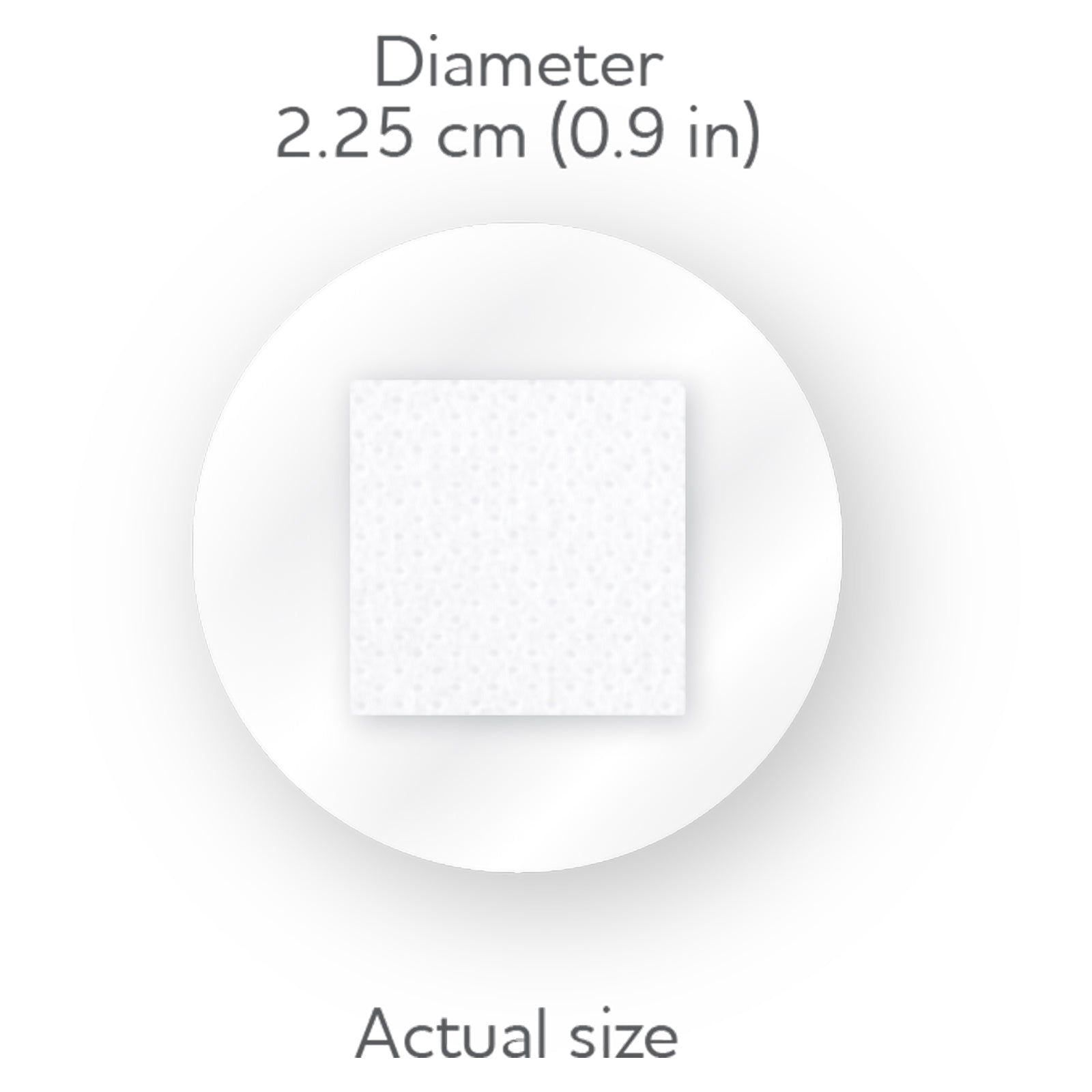 Close view of the circular AeroPlast AquaGuard dressing showing its actual size and 2.25cm diameter. The transparent outer film surrounds a small square white wound pad, illustrating the compact format designed for discreet coverage of minor wounds.