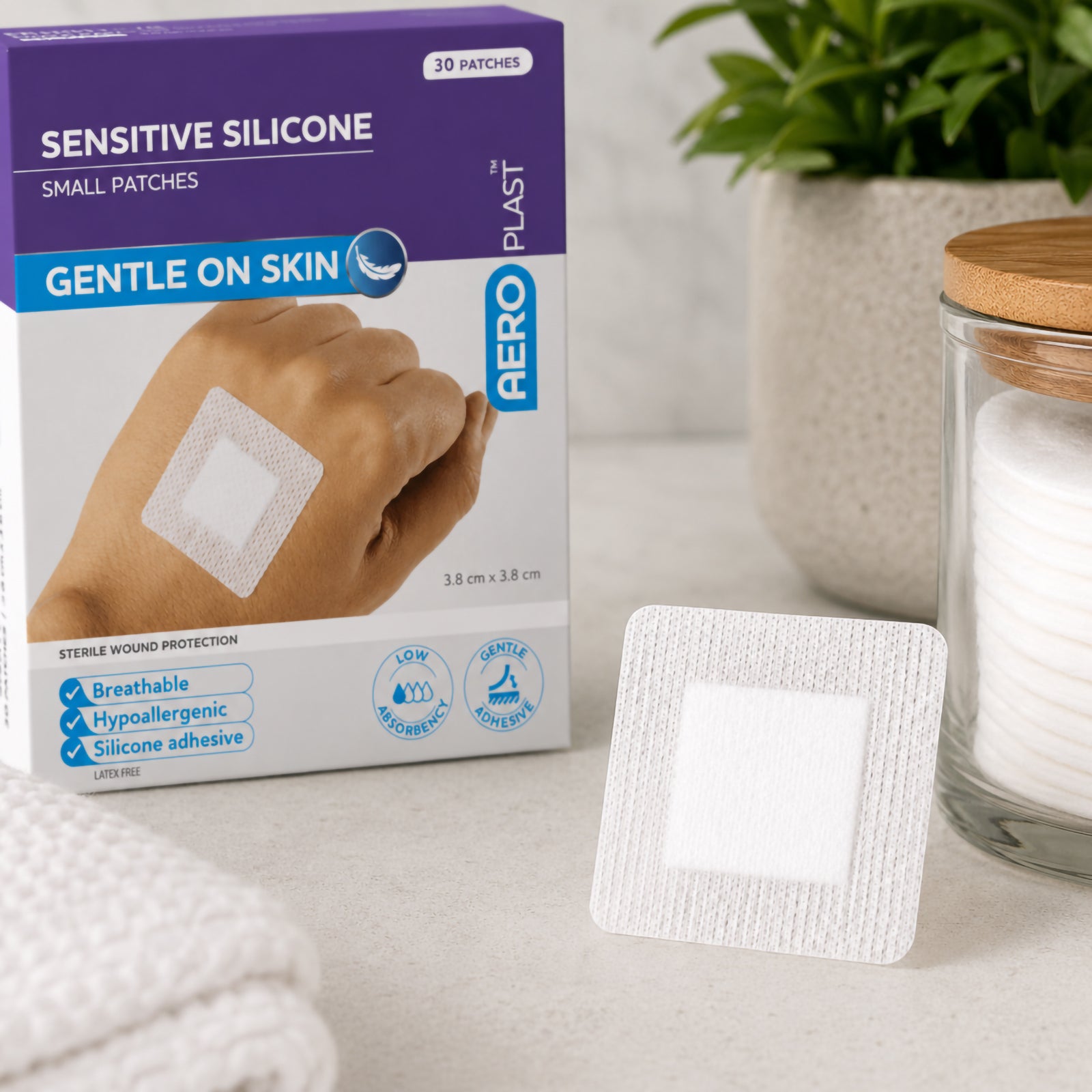 AeroPlast Sensitive Silicone Small Patches box with an individual square dressing displayed beside it, highlighting the breathable white fabric and central wound pad.