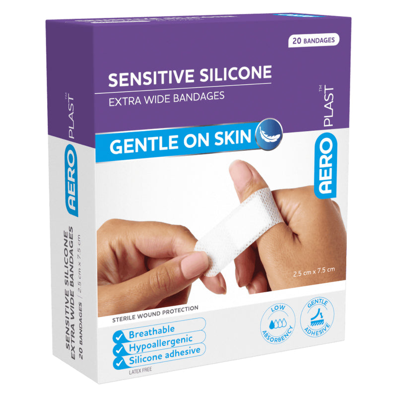 Three quarter front view of the AeroPlast Sensitive Silicone Extra Wide Bandages pack, highlighting the purple packaging, sensitive silicone construction, extra wide size and gentle skin adhesion benefits.