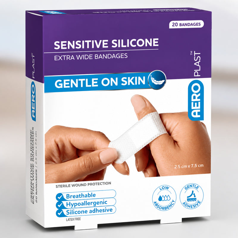 Angled product pack view of AeroPlast Sensitive Silicone Extra Wide Bandages, highlighting the 20 count box, breathable construction, hypoallergenic silicone adhesive and 2.5 x 7.5cm dressing size.