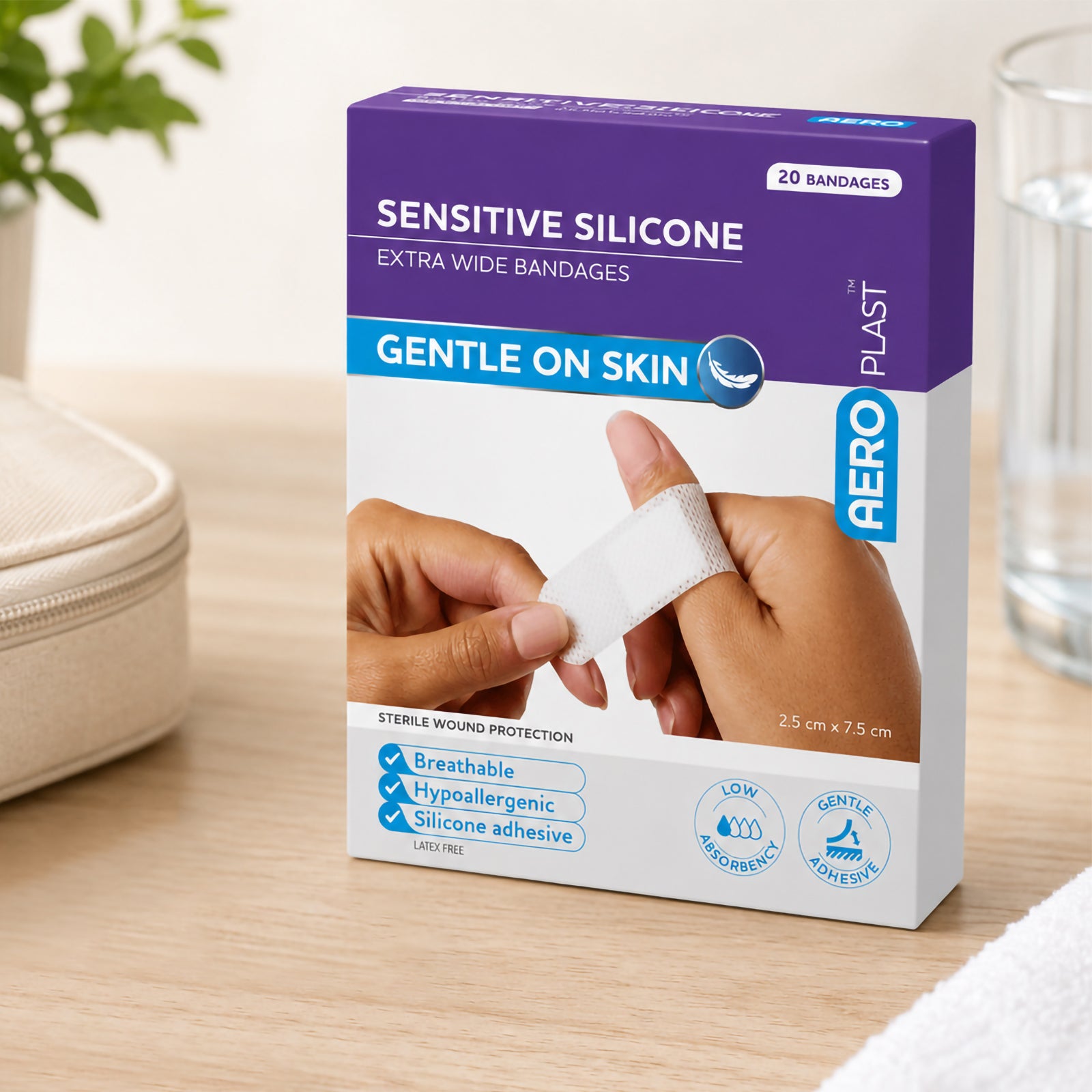 Front lifestyle view of the AeroPlast Sensitive Silicone Extra Wide Bandages pack, showing the purple and white packaging, 20 bandage quantity, 2.5 x 7.5cm size and sensitive skin positioning.