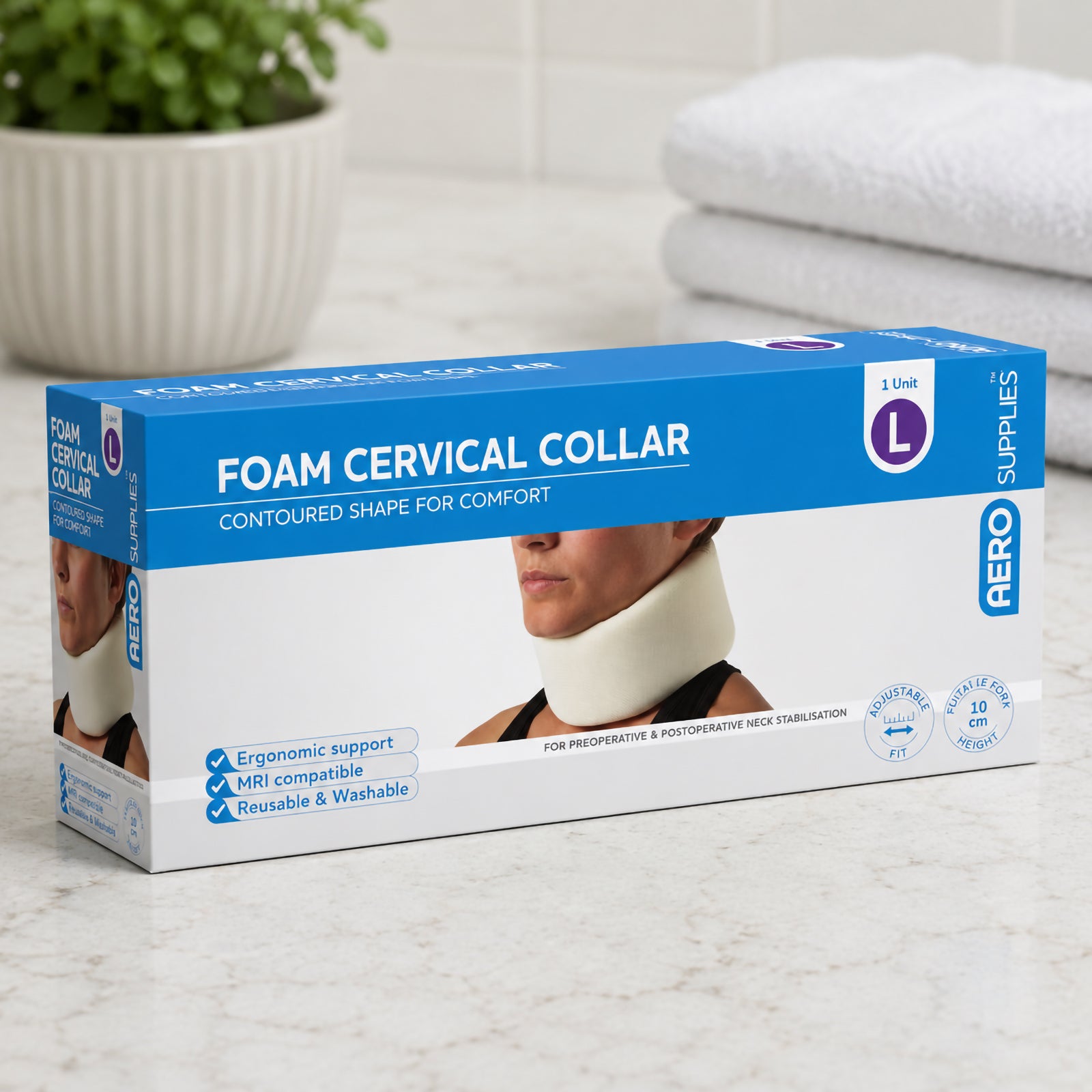 AeroSupplies Foam Cervical Collar Large retail box displayed in a clean home care setting with folded towels and a plant in the background. The packaging identifies the Large size, ergonomic support, MRI compatibility, reusable washable construction and 10cm front of neck height.