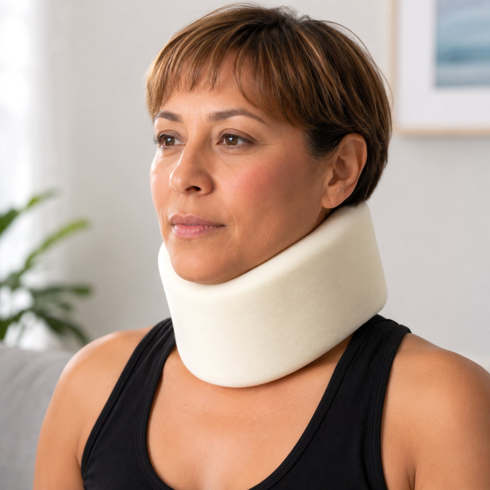 Front lifestyle view of the medium AeroSupplies cervical collar fitted around the neck, highlighting its broad supportive profile, soft foam construction and comfortable positioning beneath the chin.