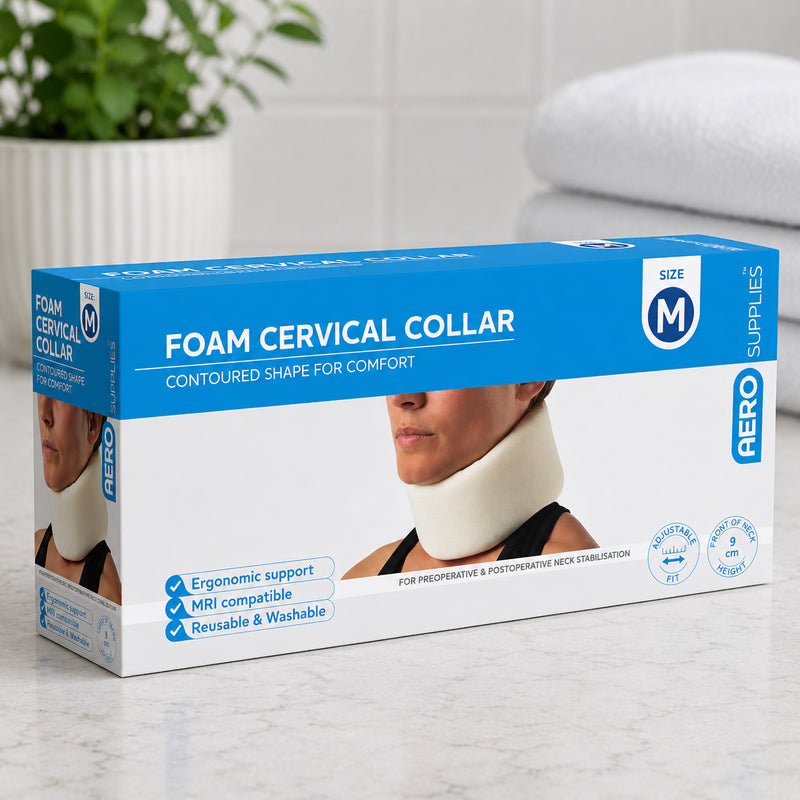 AeroSupplies Foam Cervical Collar Medium retail box displayed on a light benchtop beside folded towels and a plant, with medium size identification and 9cm front of neck height visible.
