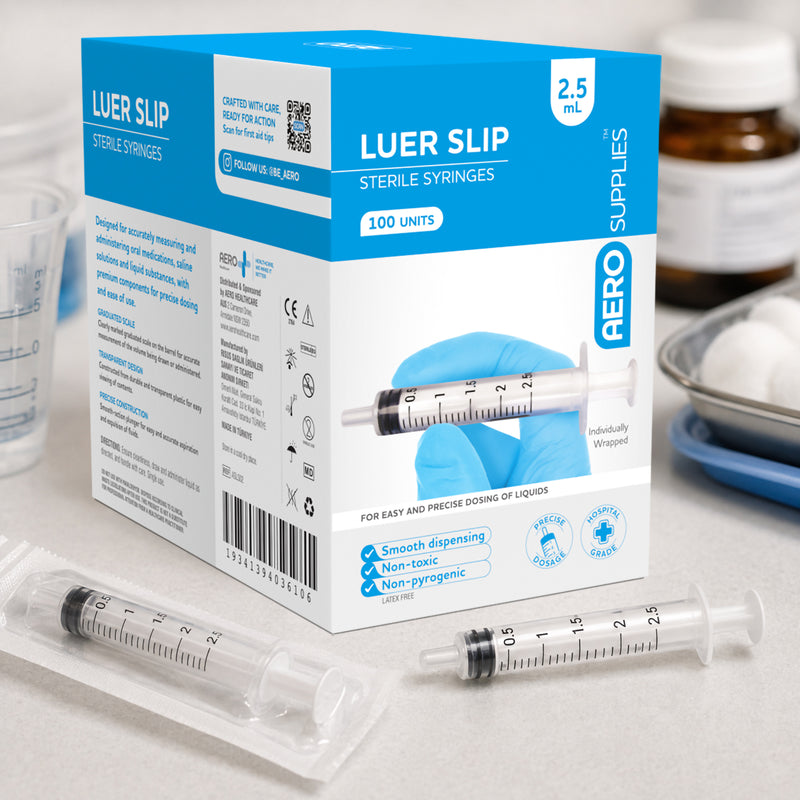 AeroSupplies 2.5ml Luer Slip Sterile Syringe Box 100 displayed with individually wrapped and unpackaged syringes in a clinical preparation setting. The image demonstrates the compact syringe size alongside the blue and white packaging designed for professional healthcare consumable storage.