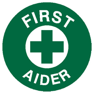 Round green sticker with a white cross, printed FIRST AIDER around the edge