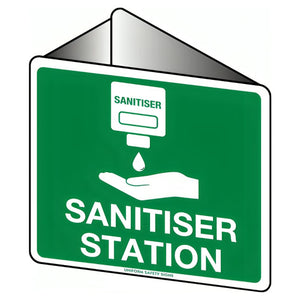 Angled green desk sign printed SANITISER STATION with a hand and dispenser symbol