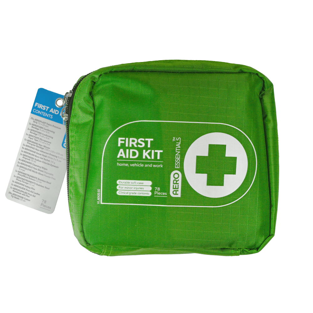 Green zipped soft case with a white cross roundel, printed First Aid Kit for home, vehicle and work, with a swing tag attached