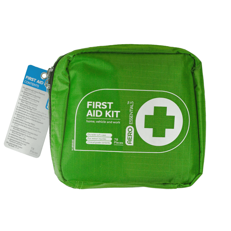 Green zipped soft case with a white cross roundel, printed First Aid Kit for home, vehicle and work, with a swing tag attached