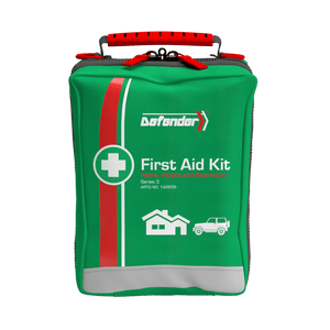 Green soft pack with a red stripe and a red carry handle, printed Defender First Aid Kit with house and vehicle icons