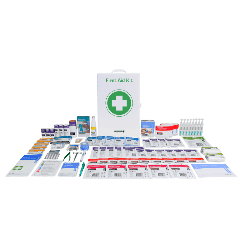 The white metal cabinet standing behind the food and beverage kit contents laid out in rows across several columns