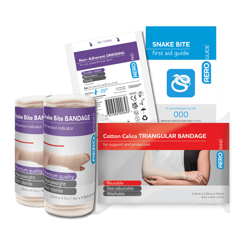 The kit contents laid out beside it, including two snake bite indicator bandages, a non-adherent dressing, a triangular bandage and a snake bite first aid guide