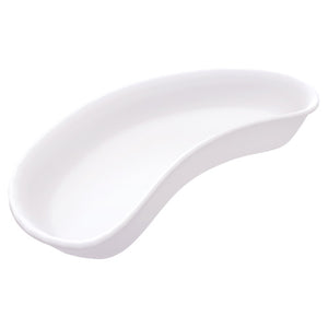White moulded kidney dish photographed from above, the curved tray used beside a treatment area