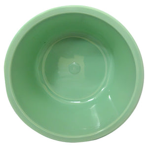 Green moulded plastic bowl photographed from above, shown empty