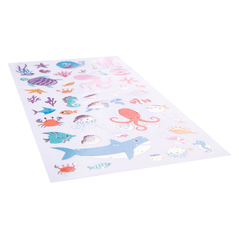 Angled close up of the complete holographic sticker sheet showcasing detailed marine life illustrations and ocean treasures with reflective foil accents that catch the light beautifully.