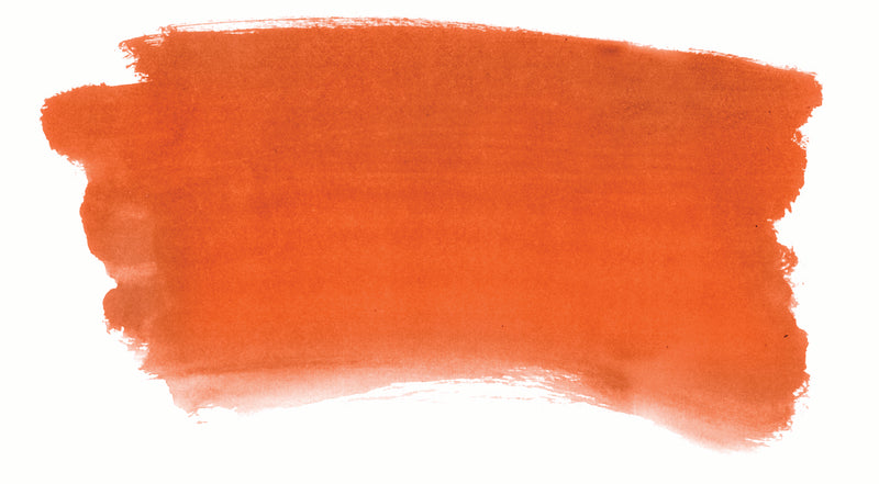 Brush-out swatch of Chroma Atelier Interactive Vermillion acrylic paint showing a vivid scarlet-orange that softens to coral at the edges