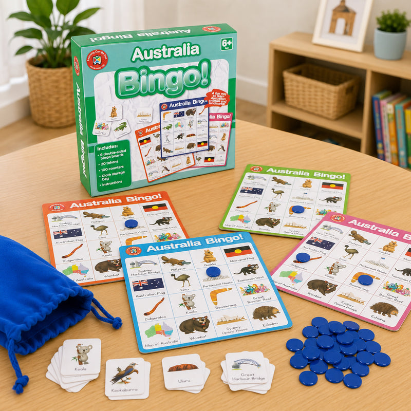 Complete Australia Bingo educational set displayed with retail packaging, bingo boards, counters, storage bag and illustrated learning tokens. The image showcases all included components designed to help children learn about Australia's unique landmarks, wildlife and national identity.