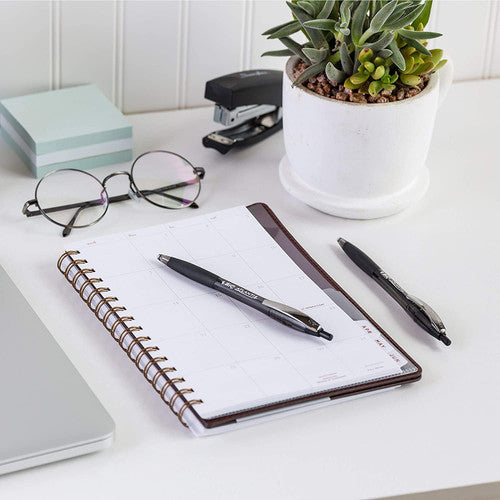 Side view of BIC Atlantis retractable pen showing clear barrel with visible ink supply