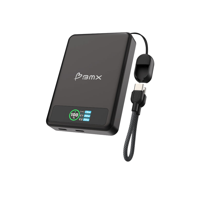 Angled product view of the black BMX power bank on a white background, showing two USB-C ports on the bottom edge, a colour display reading 100 per cent with 15w, C1 30w and C2 30w, and a separate braided USB-C lanyard.