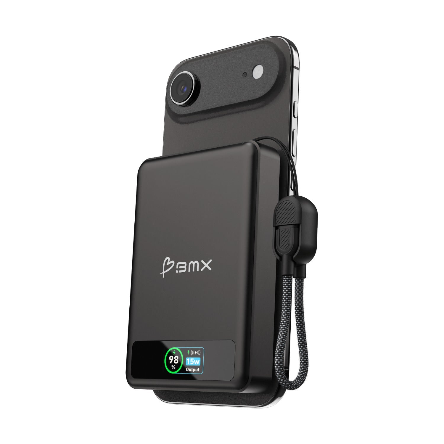Black BMX power bank held magnetically to the back of a dark smartphone and photographed at an angle, its colour display showing 98 per cent and 15w output, with the braided lanyard hanging loose beside it.